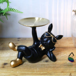 Black laying French Bulldog holding Tray